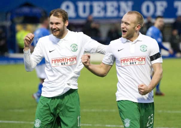 Hibernian's Martin Boyle (left) celebrates with goalscorer Dylan McGeouch as his side go in front. Picture: SNS