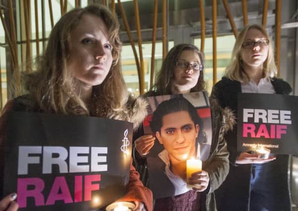 Amnesty International supporters take part in a candlelit vigil for Saudi Arabian blogger Raif Badawi. 
Picture: Jane Barlow