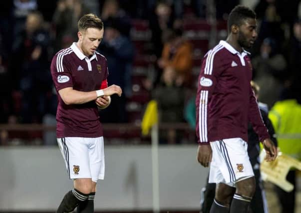 Dejection for Hearts captain Danny Wilson at full-time. Picture: SNS