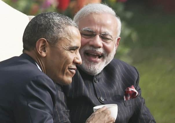 President Barack Obama and prime minister Narendra Modi share a lighter moment at Hyderabad House in New Delhi. Picture: AP