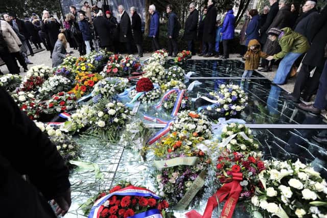 Flowers at the Auschwitz memorial in Amsterdam yesterday. Picture: Getty