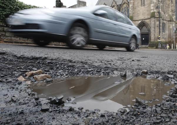 Potholes can be dangerous as well as causing damage. Picture: PA