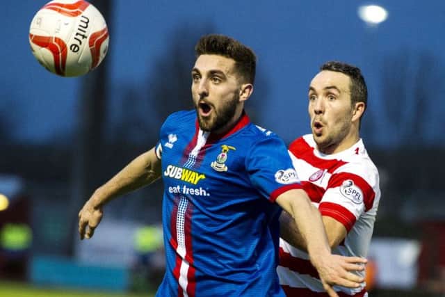 Graeme Shinnie, left, and Hamiltons Dougie Imrie battle for possession during the game at New Douglas Park. Picture: SNS Group