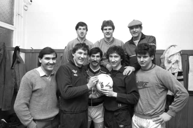 Hibernian players sign the football after the Hibs v Celtic match at Easter Road in January 1985. Picture: Alan Ledgerwood