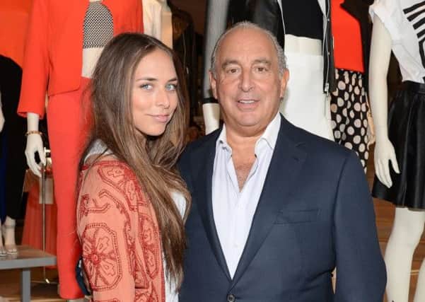 Sir Philip Green, pictured with daughter Chloe in Topshop, which forms part of his Arcadia fashion empire.  Picture: Getty