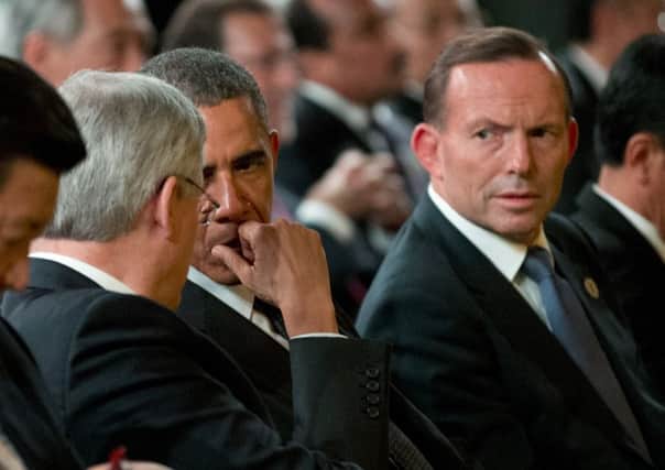 Australian Prime Minister Tony Abbott, right, beside US President Barack Obama, centre, and Canadian Prime Minister Stephen Harper. Picture: AP
