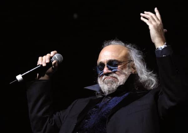 Demis Roussos performs in Paris in 2006. The flamboyant singer has died at the age of 68. Picture: Getty