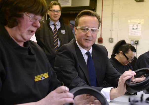 David Cameron spoke after a visit to a rubber firm yesterday. Picture:  PA