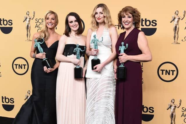 Joanne Froggatt, from left, Michelle Dockery, Laura Carmichael and Phyllis Logan pose with their award for Downton Abbey. Picture: AP