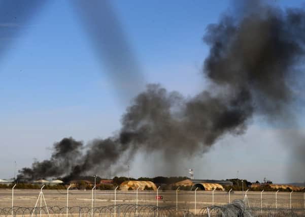 Smoke rises from the scene of the crash at the Los Llanos base in Spain where the Nato exercise was taking place yesterday.  Picture: AP