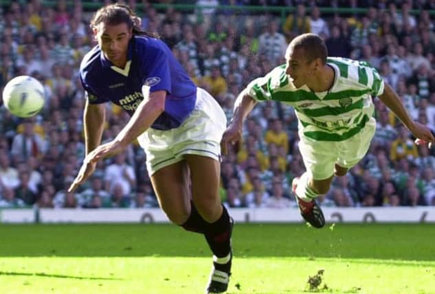 Lorenzo Amoruso and Henrik Larsson go for the ball during the Old Firm match in October 2002. Picture: TSPL