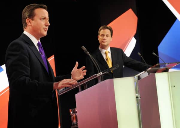 David Cameron (left) speaking as Lib Dem leader Nick Clegg looks on in a TV debate staged in 2010 prior to the last general election. Picture: PA