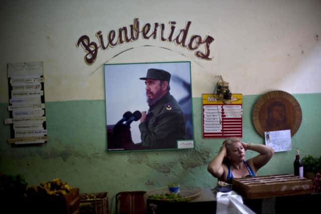 A staterun food market in Havana displaying an image of Fidel Castro, who cautiously welcomed restoring US ties. Picture: AP