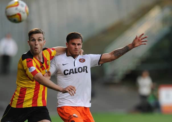 Stephen O'Donnell battles with David Goodwillie of Dundee United during a match in 2013. Picture: Robert Perry