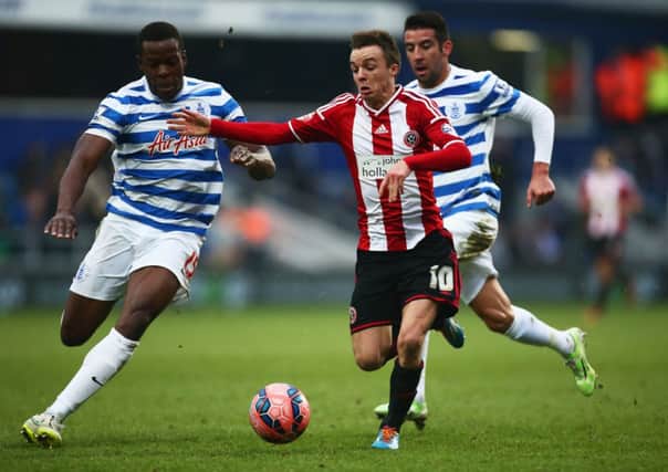 Stefan Scougall takes on Nedum Onuoha of QPR in the FA Cup third round. Picture: Getty