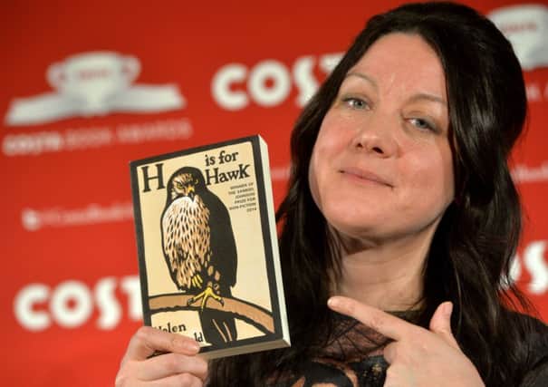 Helen Macdonald shows off her award-winning book. Picture: Getty