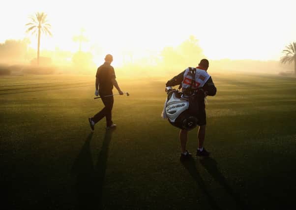 Stephen Gallacher and caddie Damian Moore on the 10th fairway during the proam ahead of the Omega Dubai Desert Classic. Picture: Warren Little/Getty Images