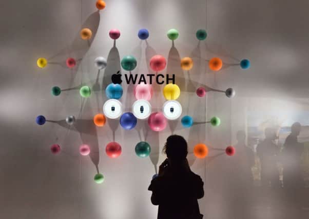 Apple hopes the good times keep rolling with its latest toy, the wristwatch,out in April. Picture: Loic Venance/AFP/Getty