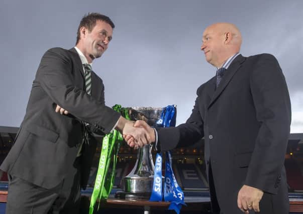 Celtic manager Ronny Deila shakes hands with Rangers counterpart Kenny McDowall at Hampden. Picture: Jeff Holmes