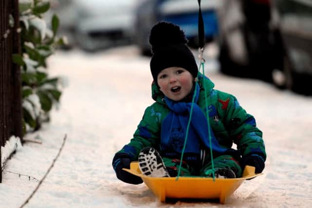 Jamie Thom, 3, sledging on his way to nursery in Glasgow. Picture: Hemedia