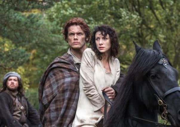 Caitriona Balfe and Sam Heughan star in lucrative romantic fantasy Outlander. Picture: AP