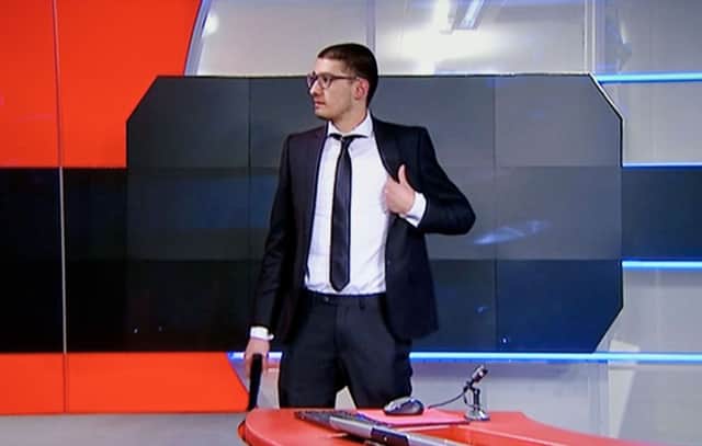 The man enters the NOS studio brandishing what turned out to be a fake handgun. Picture: Getty