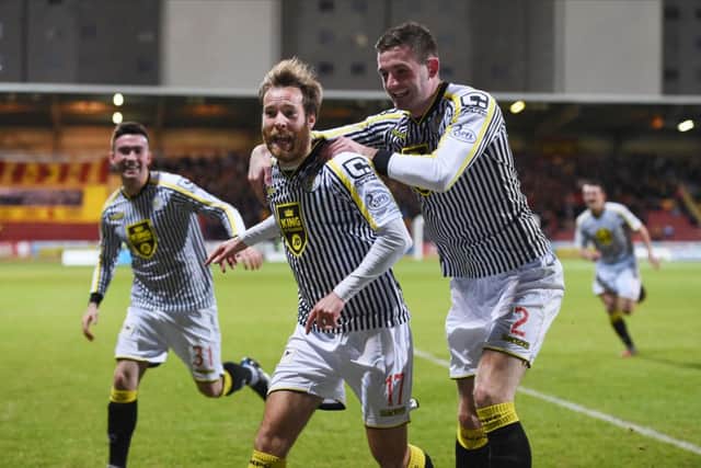 James Dayton (centre) celebrates scoring on his debut for St Mirren. Picture: SNS