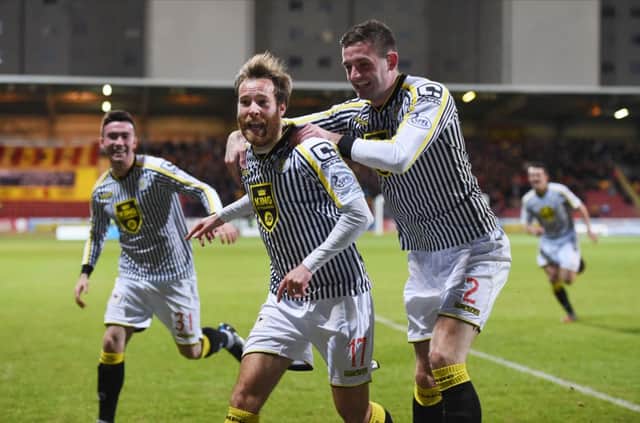 James Dayton (centre) celebrates scoring on his debut for St Mirren. Picture: SNS