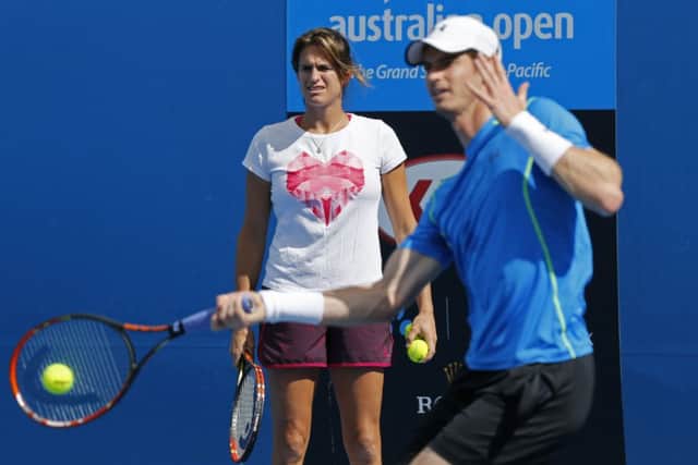 Murray and Amelie Mauresmo during practice in Melbourne yesterday. Picture: AP