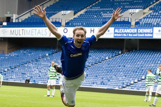 He may be a Celtic fan but for MP and Scottish Labour leader Jim Murphy scoring has to be celebrated even when its in a Rangers strip at Ibrox against a team in hoops in a charity game. Picture: SNS