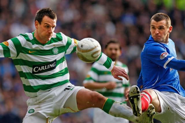 Jan Vennegoor of Hesselink tackles Lee McCulloch in a 2009 Old Firm derby. Picture: Getty