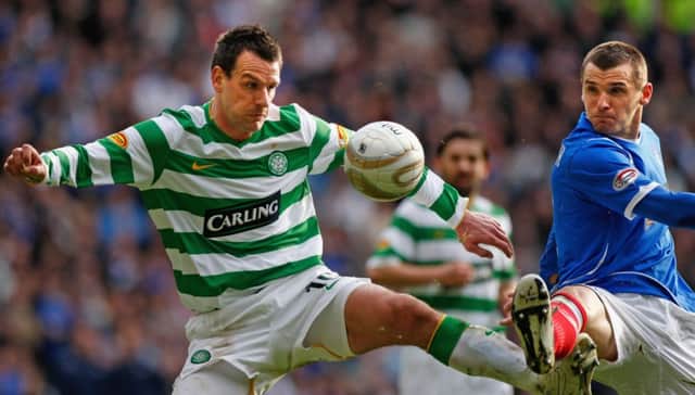 Jan Vennegoor of Hesselink tackles Lee McCulloch in a 2009 Old Firm derby. Picture: Getty