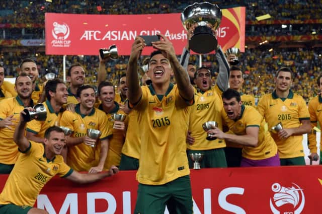 Swindon Towns Massimo Luongo takes a selfie as Australia celebrate with the Asian Cup. Picture: AFP/Getty