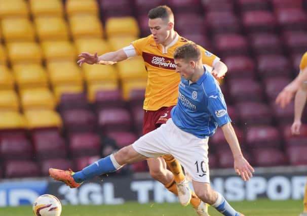 St Johnstone's David Wotherspoon is put under pressure from Simon Ramsden. Picture: SNS