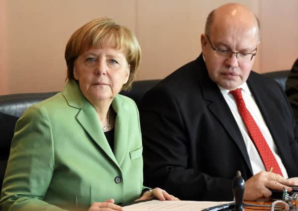 German Chancellor Angela Merkel and German Chief of Staff Peter Altmaier await the start of the weekly cabinet meeting. Picture: Getty