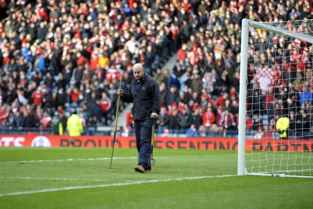 The Hampden Park pitch cut up during yesterdays first semi-final between Dundee United and Aberdeen. Picture: John Devlin