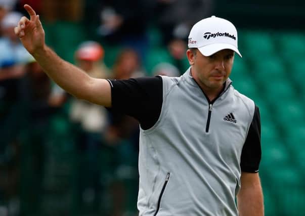 Martin Laird acknowledges the crowd on 16 green during the third round of the Waste Management Phoenix Open. Picture: Getty
