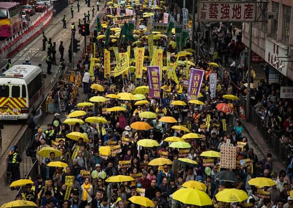 Prodemocracy campaigners make their way through Hong Kong. Picture: Getty