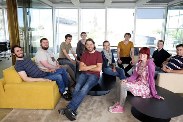 John Peebles, seated centre, and the Administrate team. The fresh funding will help it expand its presence in North America