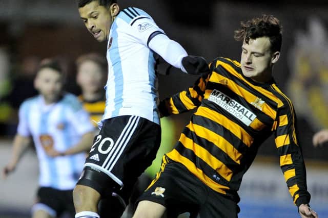 Alloa defender Kyle Benedictus tackles Hearts striker Osman Sow. Picture: Ian Rutherford