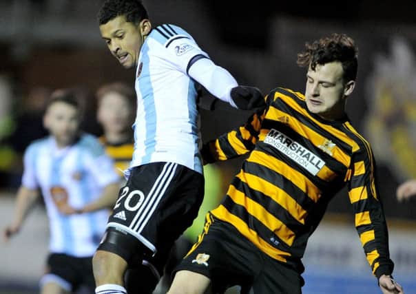 Alloa defender Kyle Benedictus tackles Hearts striker Osman Sow. Picture: Ian Rutherford