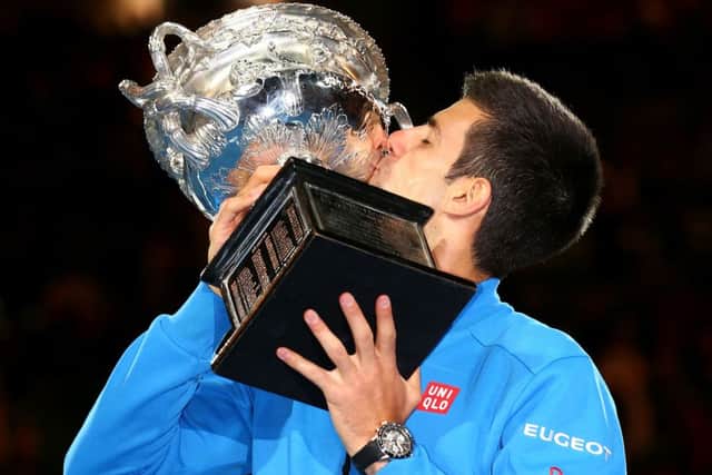 Novak Djokovic kisses the trophy after winning his men's final match. Picture: Getty