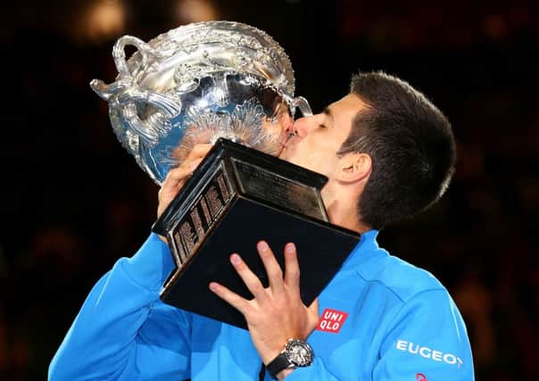 Novak Djokovic kisses the trophy after winning his men's final match. Picture: Getty