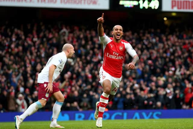Alan Hutton screams at his team-mates as Theo Walcott celebrates scoring Arsenals third goal . Picture: Getty