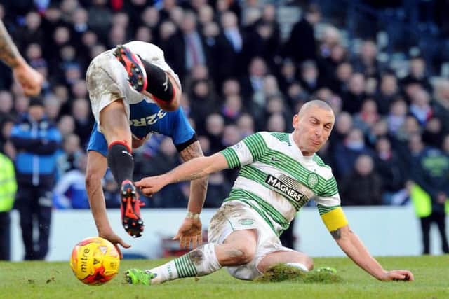 Scott Brown slides into a challenge on Ian Black in yesterdays League Cup semi-final. Picture: Lisa Ferguson