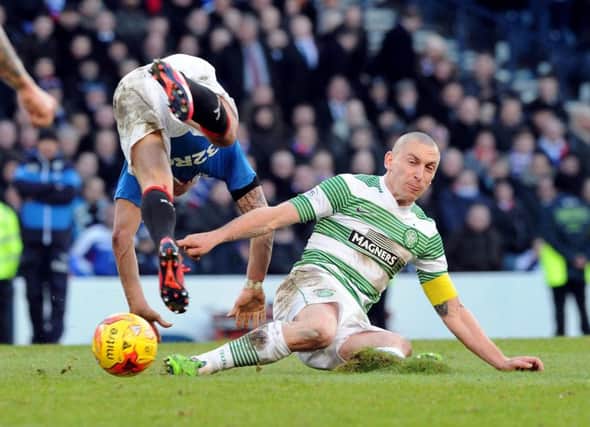 Scott Brown slides into a challenge on Ian Black in yesterdays League Cup semi-final. Picture: Lisa Ferguson