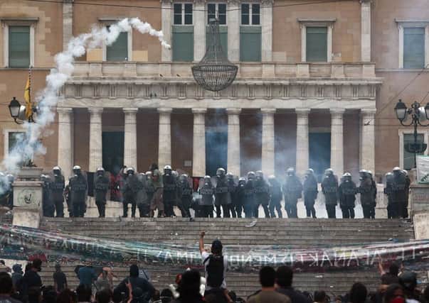 The Greek parliament in Athens had to have police protection during anti-austerity protests. Picture: AFP