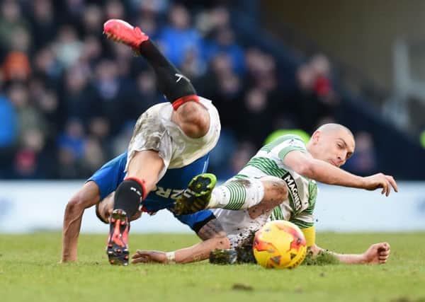 Pitched battle: 
Celtic's Scott Brown (right) tackles Ian Black. Picture: SNS