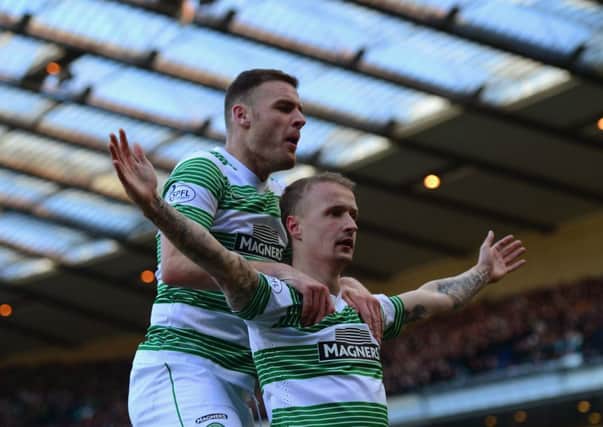 Leigh Griffiths celebrates scoring the opening goal with Anthony Stokes of Celtic on Sunday. Picture: Getty