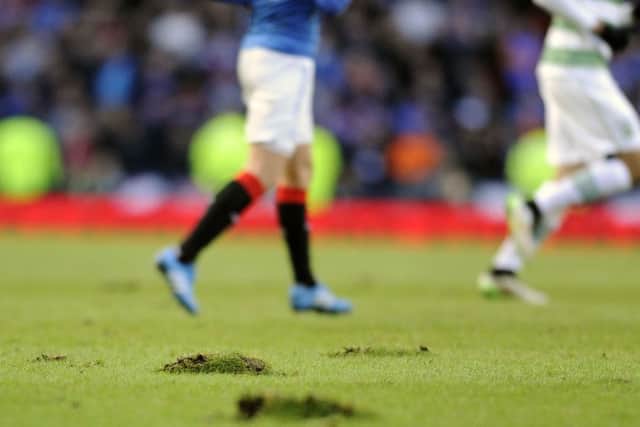 Serious questions were asked about the state of the Hampden turf during Sunday's game. Picture: John Devlin